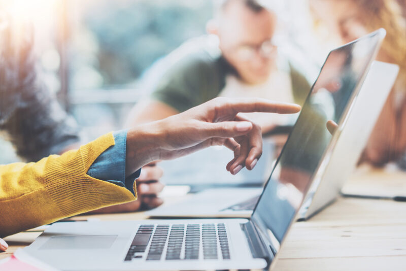 Pointing at a screen of membership renewals